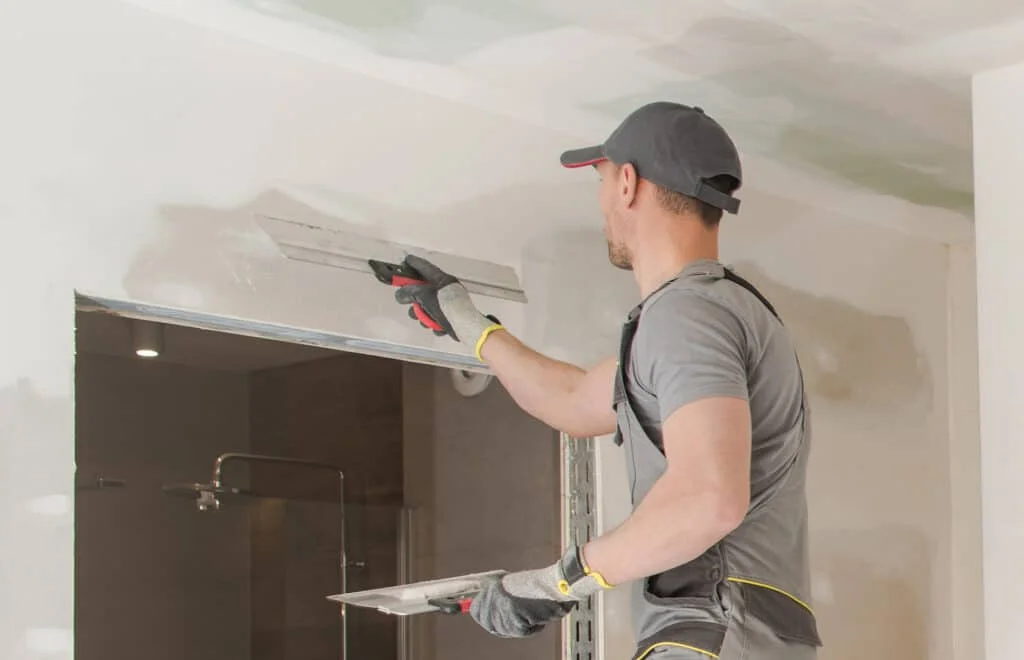 man repairing drywall